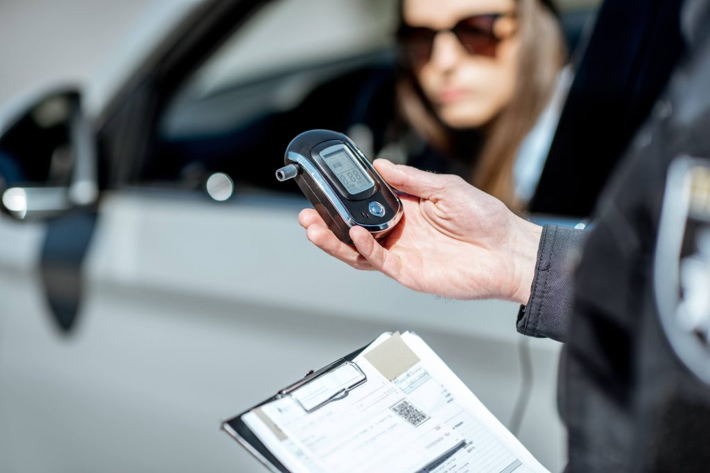Policeman holding device for checking alcohol intoxication
